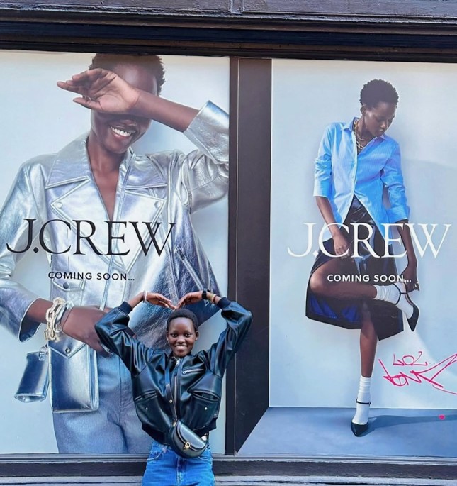 Caren in front of her J.Crew campaign in New York